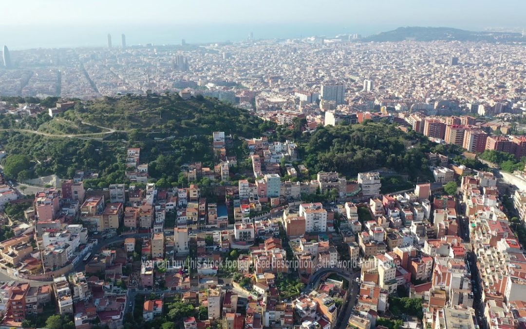 Aerial Stock Footage: Flying with Drone over City Barcelona in Spain | urban houses and streets | 4k