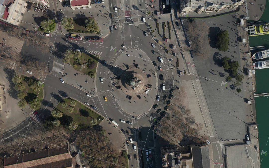 AERIAL: Overhead Shot of Columbus Monument Roundabout in Barcelona, Spain with Busy Car traffic on